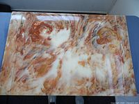 Top view of marble blotter surface showing natural stone texture and colors.