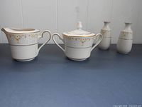 Porcelain Noritake 7025 Fragrance pattern gold rimmed sugar bowl, creamer, and salt & pepper shakers