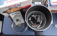 Photo of Rival 8 QT Chef Pot with glass lid, metal pot, detachable power cord, control unit, and original box and manual included.