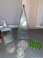 Top view of triangular vintage glass display case showing two levels inside.