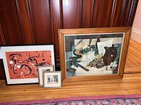 Wide view of three framed prints showing different styles and sizes, including the George Braque print in a brown wood frame.