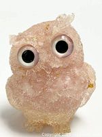 Front view of the amethyst resin owl figurine with large eyes