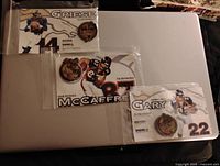 Photo showing three football pins for Brian Griese, Ed McCaffrey, and Olandis Gary on player cards.