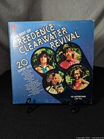 Front cover of the Creedence Clearwater Revival vinyl record "The Best of Creedence Clearwater Revival" showing circular photos of the band and album title prominently.