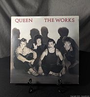 Front cover of Queen "The Works" vinyl record - grayscale band portrait.
