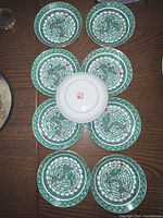 Seven plates arranged top-down to show full lot and design