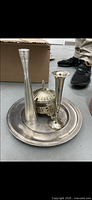 Top view of silver tray with two slender vases and decorative covered bowl, showing overall condition and details