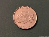 Obverse side of the coin showing turtle swimming design with text CANADA 1867-2017 5 CENTS