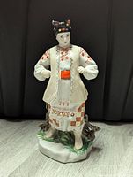 Front view of the porcelain Odarka figurine showing detailed traditional costume and face.