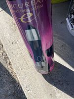 Photo of the sealed purple cylindrical box packaging for the Epicurean vacuum wine saver, showing the device image and branding.