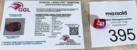 Certificate from GGL for 13.03 ct man-made ruby with details on gemstone characteristics and authentication.