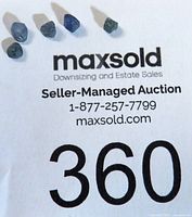 Photo showing all five sapphire crystals on auction lot card.