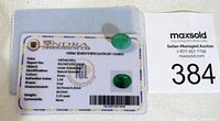 Certification card from IGL Gemological Lab showing detailed information for the loose emerald gemstone, including report number, measurements, weight, color and images of the emerald.