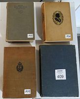 Four vintage hardcover books arranged flat; titles visible with date tags 1937, 1934, 1919 plus a blue covered book
