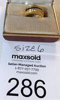 Photo of the gold ring in a box with size 6 label and lot number 286.