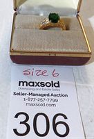 Ring in display box with auction lot number and size tag visible.