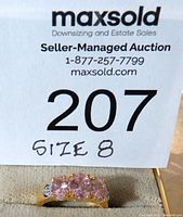 Ring shown with auction label indicating size 8.