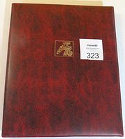 Maroon faux leather folding book cover with gold embossed Spirit of 76 logo and lot number sticker.