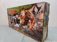 Box front and side showing Heroscape Master Set Swarm of the Marro 2007 artwork and branding, showing visible wear and tear on box edges.