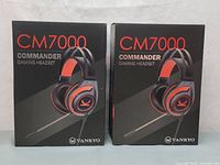 Front view of two VANKYO CM7000 Commander gaming headset boxes, highlighting product branding and headset image.