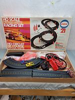 Overview of box, track sections, cars, controllers and accessories