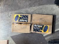 Top view photo showing two boxed Duralast brake rotors Model 72019DG with original packaging in worn condition.
