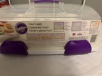 Wilton 3-in-1 caddy closed view showing locking mechanism and label.