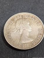 Obverse side of the silver Canadian dollar coin displaying Queen Elizabeth II profile and legend.