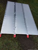 All three ramp sections unfolded side by side on grass