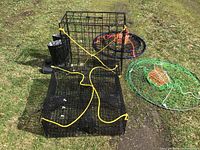 Overview of two rectangular traps and two ring traps arranged on grass