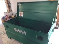 Front view of open Greenlee storage box on wheels
