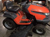 Side profile showing seat, deck housing and steering wheel