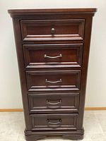 Full front view of the five-drawer lingerie dresser with drawer handles and knob.