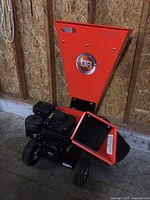 Front view of DR Power Equipment wood chipper showing feed hopper and engine