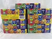 Front view of the stacked eleven unopened three-pack boxes of Crayola Silly Scents Dough displaying colorful packaging and multiple boxes.