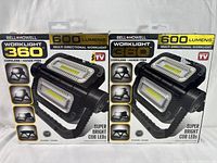 Two sealed boxes of Bell+Howell Worklight 360 work lights showing front of packaging with product image and features.