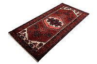 Rectangular antique Zanjan rug with geometric patterns and natural colors laid flat for viewing.
