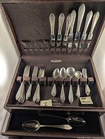 Full set in fitted Wolff Chest Pacific Silver Cloth case showing knives in lid and spoons/forks below