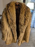 Front view of fur jacket hanging