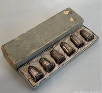 Set of six hammered sterling silver salt and pepper shakers in original gray box with satin lining, box shows wear.