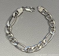 Top view of the sterling silver bracelet showing the chain links and clasp.