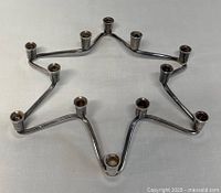 Top side view of the silver plated Star of David candle holder showing 12 candle sockets.