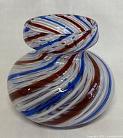 Full view of the MCM Italian Latticino Murano art glass vase showing the spiraled stripe pattern and shape.