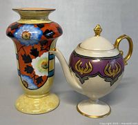 Vase and teapot front view with detailed decorations visible