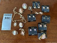 Overview of all jewelry items on wooden surface