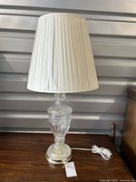 Full lamp with pleated white shade on, showing overall design and dimensions.