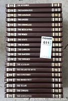 Photo showing 18 of the books in the set arranged vertically with spines visible, titles visible include The Rivermen, The Railroaders, The Canadians, The Loggers, The Chroniclers, The Mexican War, The Women, The Scouts, The Soldiers, The Gamblers, The Ranchers, The Townsmen, The Alaskans, The End and The Myth, The Expressmen, The Spanish West, The Texans, The Cowboys, and The Gunfighters.