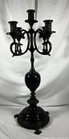 Full view of antique French five-arm candelabra showing the entire piece, black marble base, and bronze candle holders and arms.