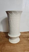 Front view of ivory Lenox vase with detailed autumn leaf embossing and no visible damage.