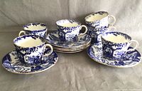Six Royal Crown Derby porcelain tea cups and saucers arranged in two rows, showing the full set.
